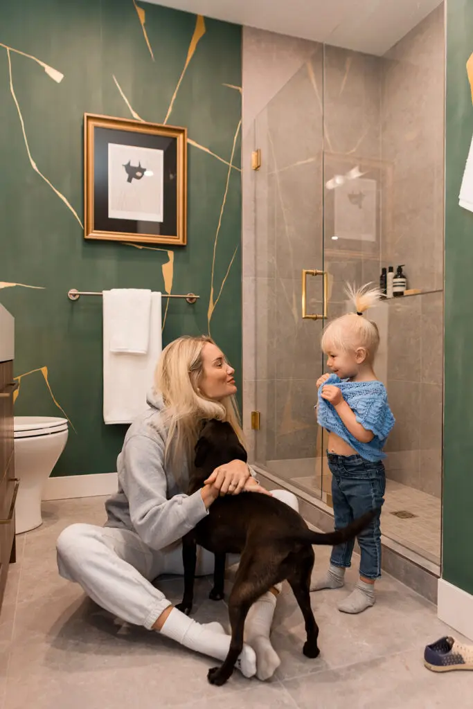 A family getting ready in their beautiful bathroom at Morrison Walk